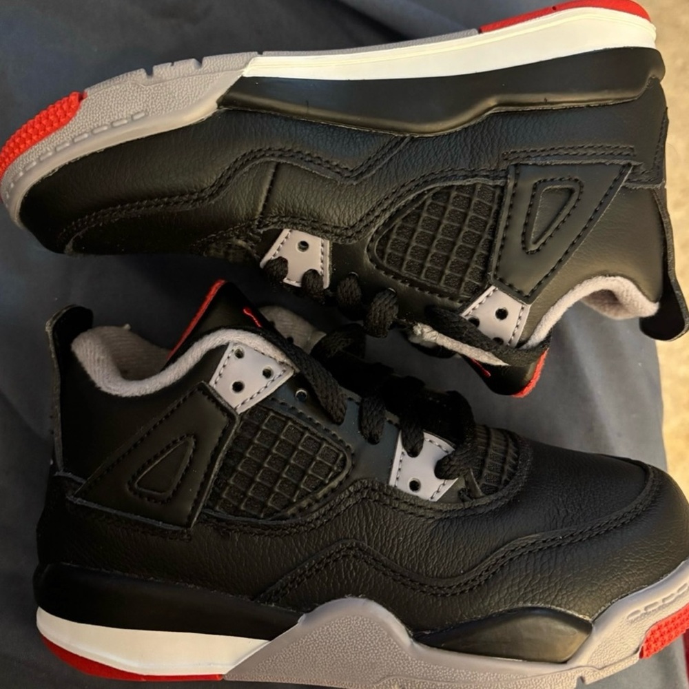 Kids’ size 11 black Jordan sneakers. New, never worn, without box.